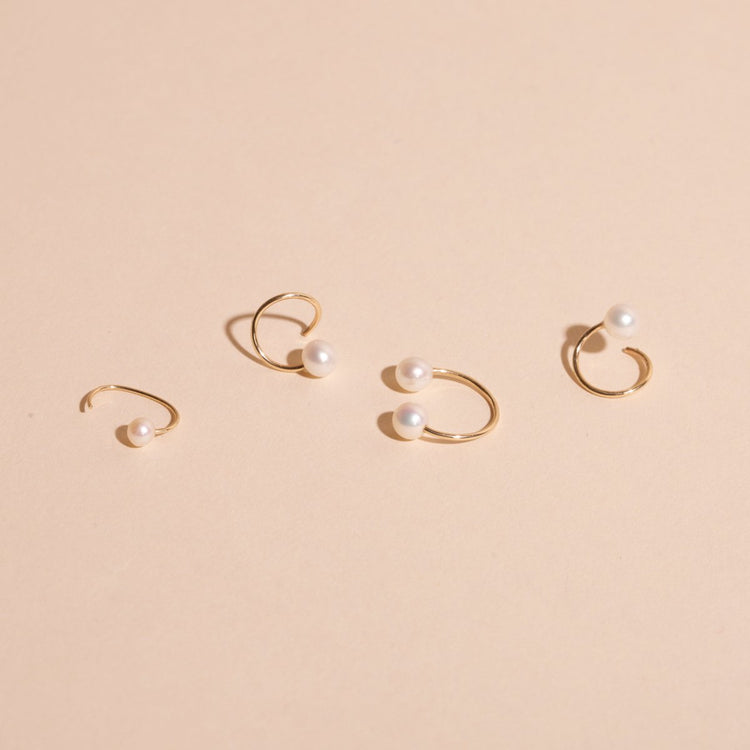 Still life image of Pearl Open Huggie with Stone and Strand solid gold jewelry