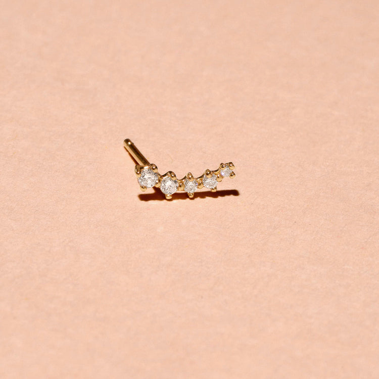Stone and Strand 10K Yellow Gold Medium Ear to Ear Diamond Curve Studs Front Editorial Image