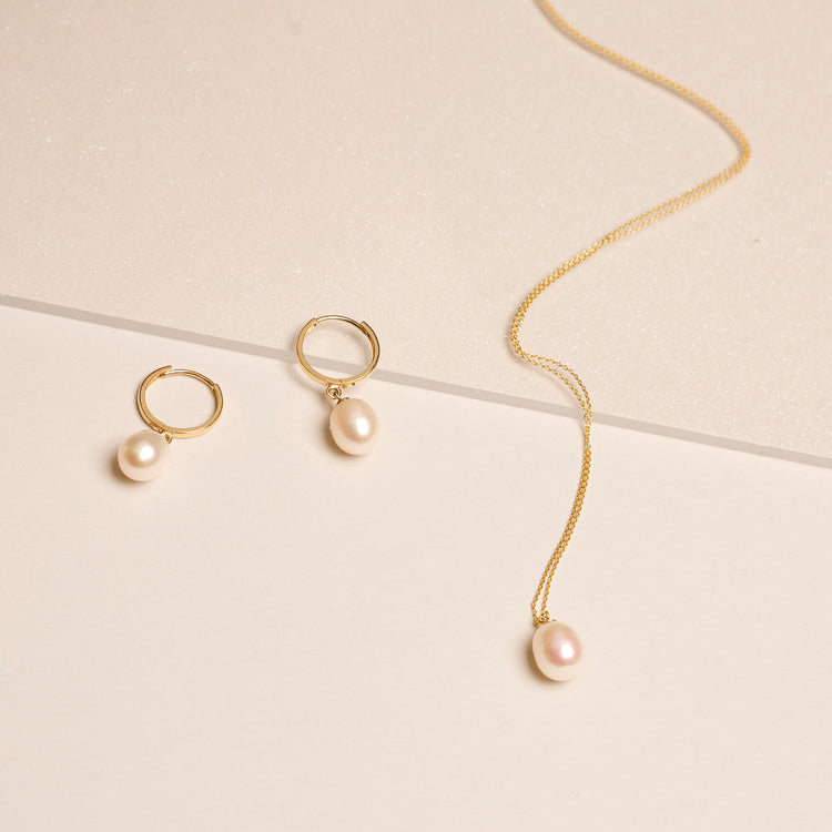 Still life image of Elliptical Pearl Pendant Necklace with Stone and Strand solid gold jewelry