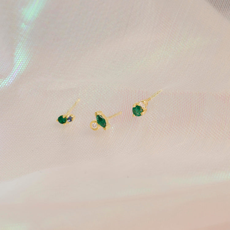 Still life image of Emerald and Sapphire Buddy Stud with Stone and Strand solid gold jewelry
