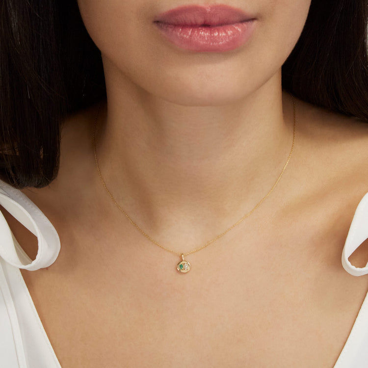 Image of 10K Yellow Gold Emerald Luxe Mini Medallion Necklace with White Diamond on Models Neck