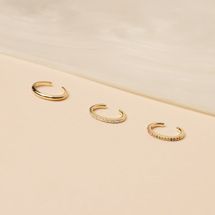Still life image of Fine Ear Cuff with Stone and Strand solid gold jewelry