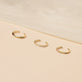 Still life image of Fine Ear Cuff with Stone and Strand solid gold jewelry