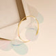 Stone and Strand 10K Yellow Gold Flat Cuff Bracelet Editorial Image
