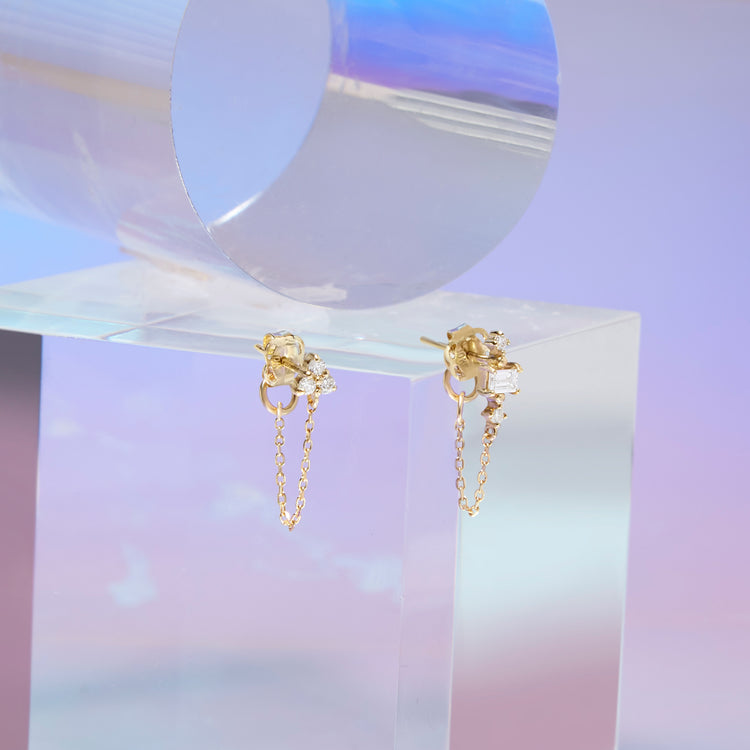 Stone and Strand 10K Yellow Gold Front To Back Pillar White Sapphire Stud Editorial Image