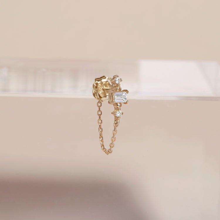 Stone and Strand 10K Yellow Gold Front To Back Pillar White Sapphire Stud Editorial Image