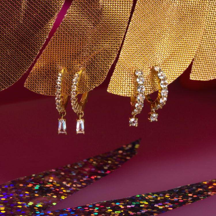 Icicle Topaz Huggies