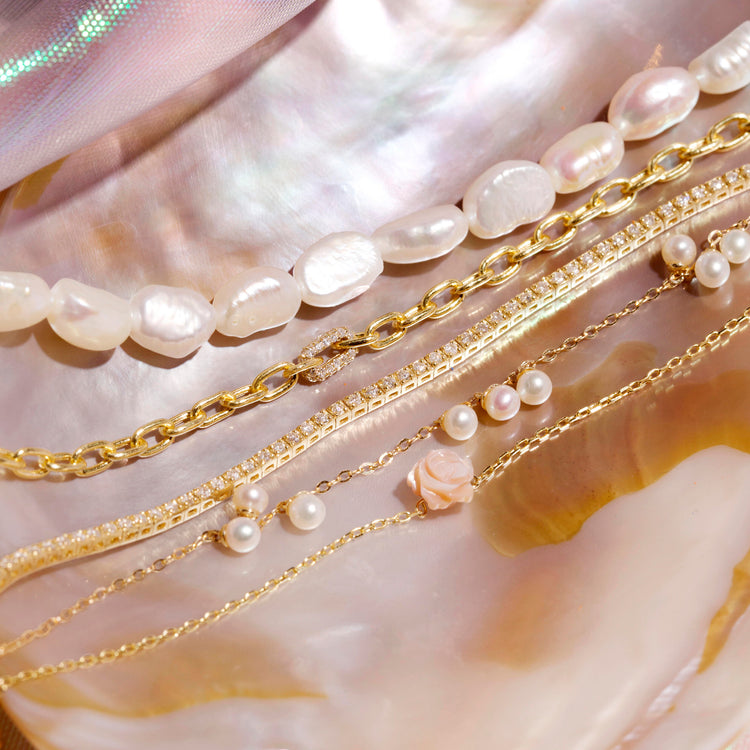 Still life image of In Bloom Pearl Bracelet with Stone and Strand solid gold jewelry