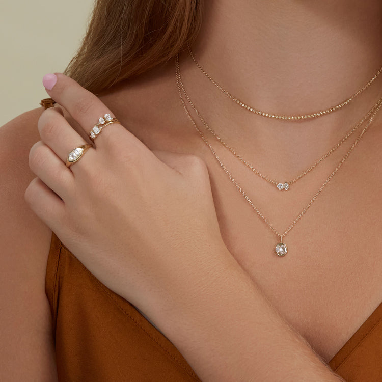 Model wearing Lab-Created Diamond Festival Ring with solid gold Stone and Strand jewelry