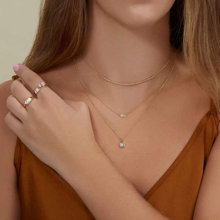 Model wearing Lab-Created Diamond Soiree Medallion Necklace with solid gold Stone and Strand jewelry