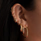 Model wearing Large Classic Hoops with solid gold Stone and Strand jewelry