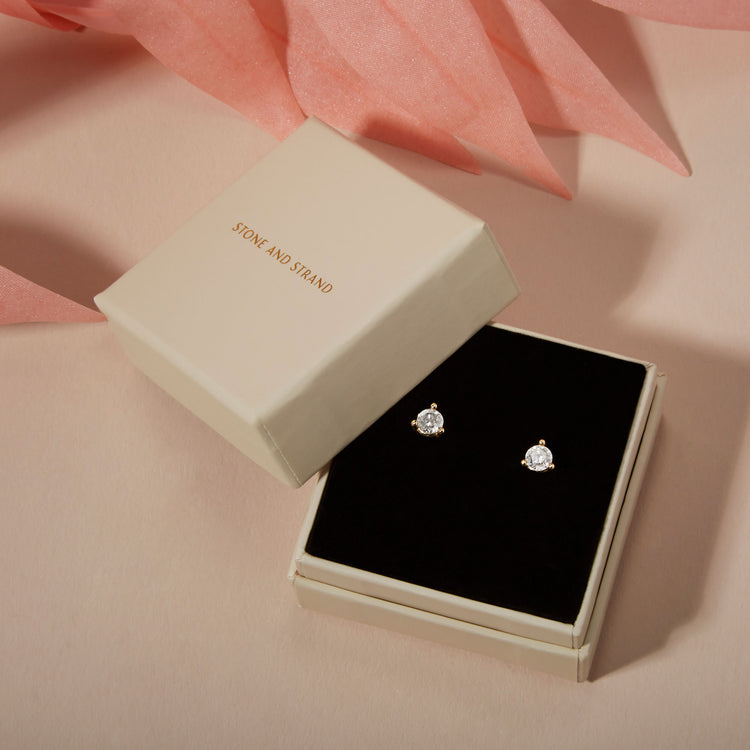 Still life image of Large Diamond Studs with Stone and Strand solid gold jewelry