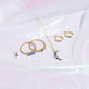 Still life image of Small Le Bleu Double Stud with Stone and Strand solid gold jewelry