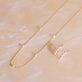 Still life image of Lucky Pearl Necklace with Stone and Strand solid gold jewelry