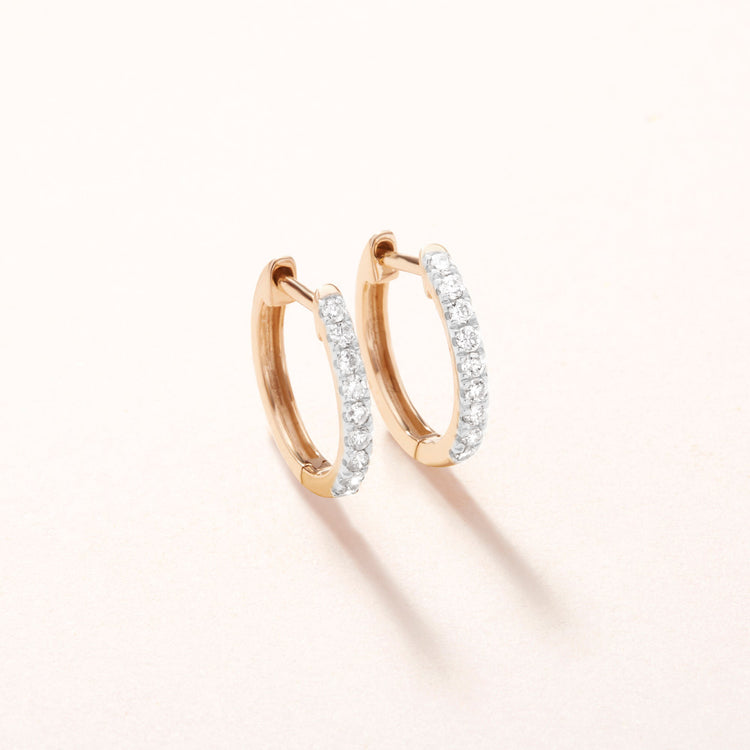 Stone and Strand 10K Yellow Gold Diamond Pave Huggie Earrings Editorial Image