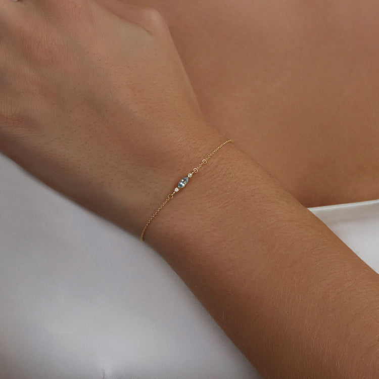 Image of 10K Yellow Gold White Sapphire Mermaid Treasure Bracelet with Aquamarine on Models Arm