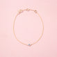 Stone and Strand 14K Yellow Gold Mini Pave Diamond Evil Eye Bracelet Editorial Image
