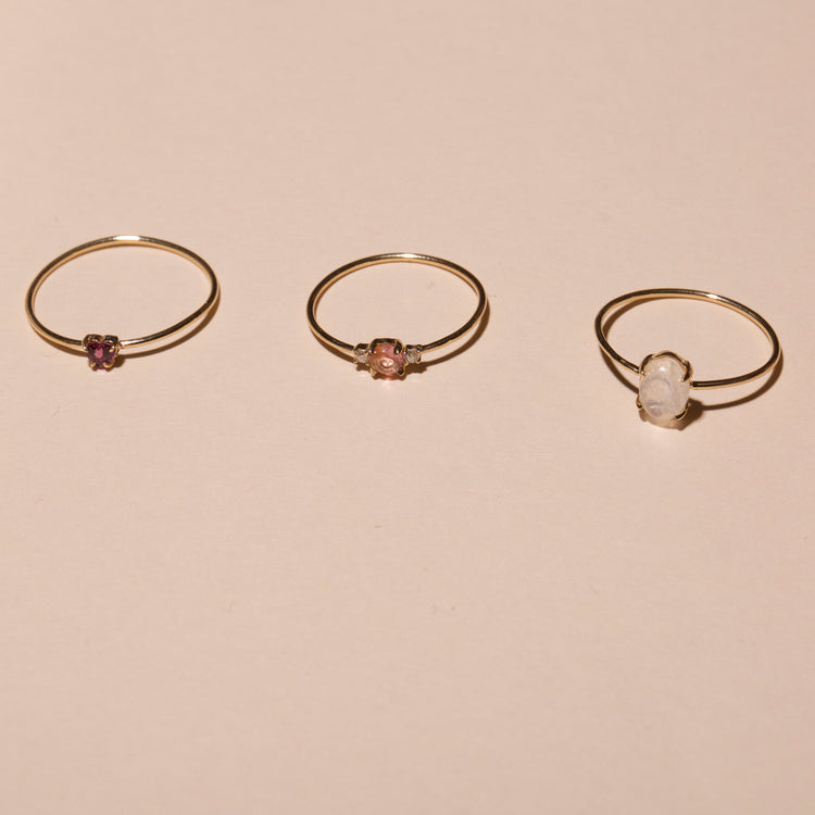 Still life image of Moonstone Oval Cabochon Fine Ring with Stone and Strand solid gold jewelry