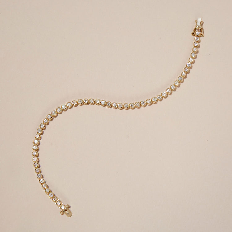 Stone and Strand 10K Yellow Gold Noble Diamond Tennis Bracelet Editorial Image