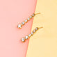 Stone and Strand 10K Yellow Gold Noble Diamond Tennis Earrings Editorial Image