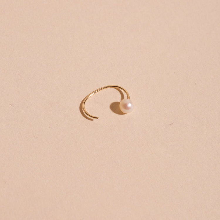 Stone and Strand 14K Yellow Gold Pearl Open Huggie Editorial Image