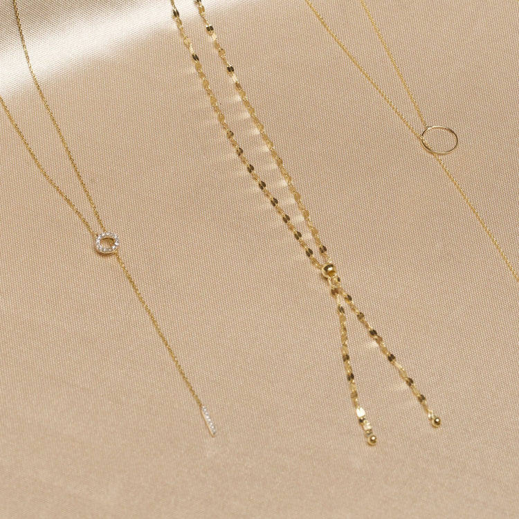 Still life image of Pave Diamond Open Circle Lariat Necklace with Stone and Strand solid gold jewelry
