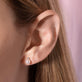 Image of 14K Yellow Gold Small Pearl and Sapphire Stud Earrings on Models Ear