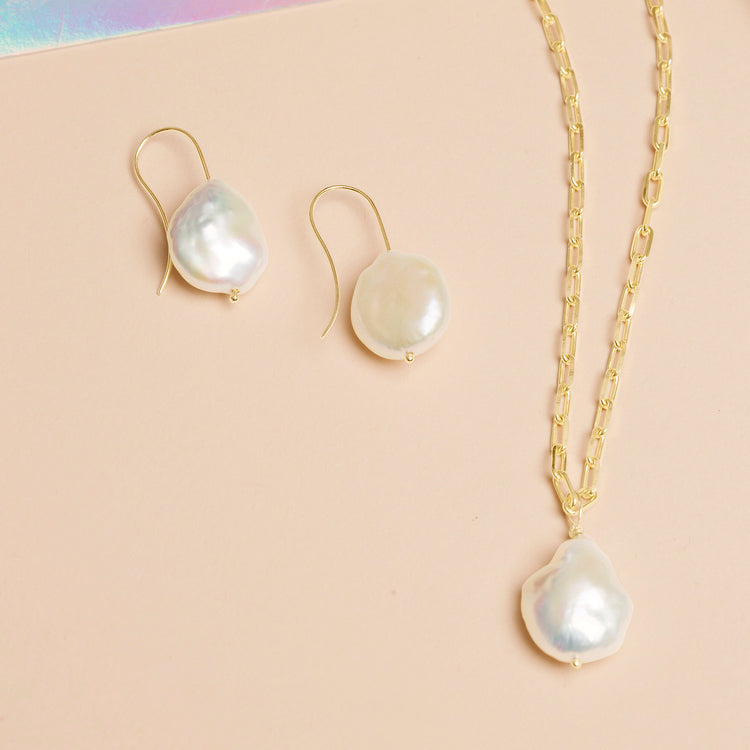 Still life image of Perfectly Imperfect Baroque Pearl Earrings with Stone and Strand solid gold jewelry