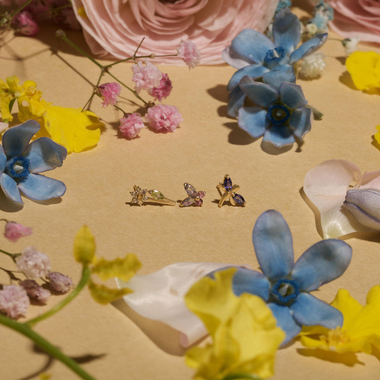 Still life image of Pick A Daisy Studs with Stone and Strand solid gold jewelry