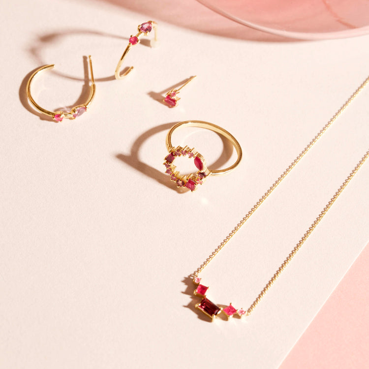 Still life image of Pink Power Hoops with Stone and Strand solid gold jewelry