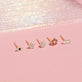 Still life image of Pink Sapphire and Diamond Flower Stud with Stone and Strand solid gold jewelry