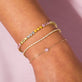 Image of 10K Yellow Gold Pink Sapphire Flower Bracelet with Stone and Strand Bracelets
