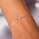 Image of 10K Yellow Gold Pink Sapphire Flower Bracelet on Models Arm