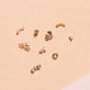 Still life image of Princess and Round Diamond Piercing Earring with Stone and Strand solid gold jewelry