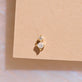 Stone and Strand 14K Yellow Gold Princess and Round Diamond Piercing Earring Editorial Image