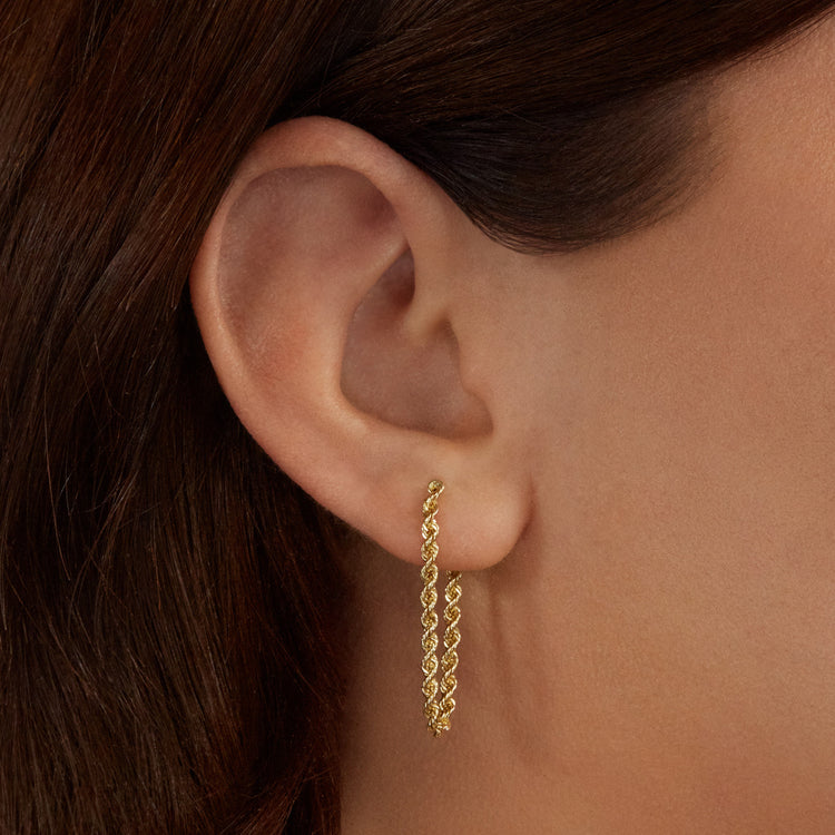 Image of 10K Yellow Gold Roped Off Front to Back Stud on Models Ear