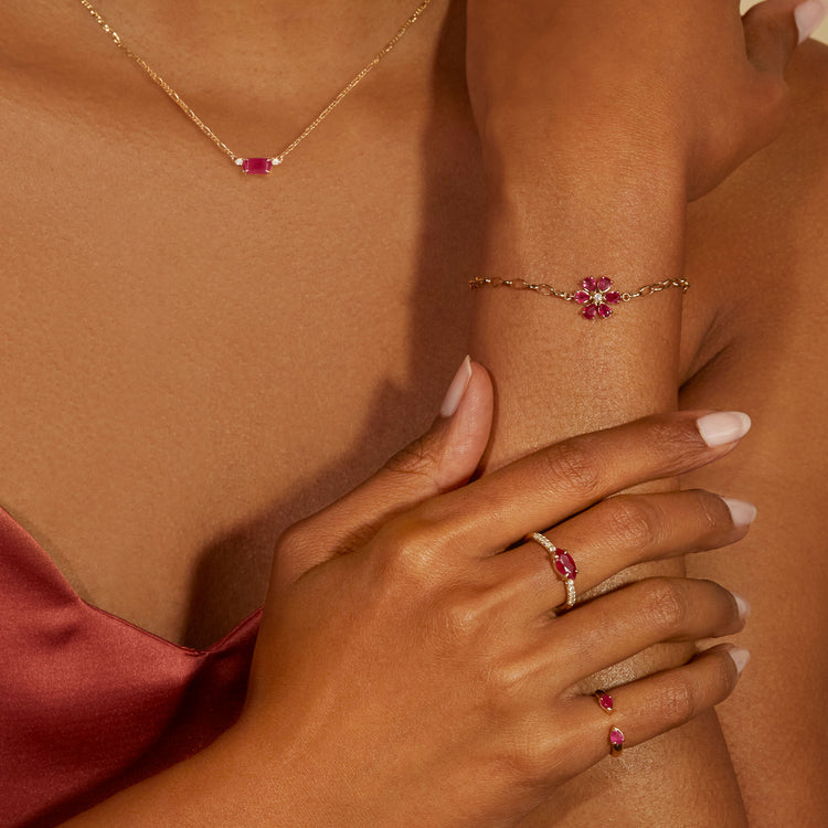Model wearing Ruby Red Diamond Necklace with solid gold Stone and Strand jewelry