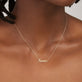 Image of 14K Yellow Gold Say My Name Script Necklace on Models Neck