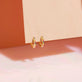 Stone and Strand 10K Yellow Gold Second Hole Teeny Unicorn Gemstone Huggie Editorial Image