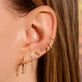 Image of 10K Yellow Gold Second Hole Teeny Unicorn Huggie with Stone and Strand Earring