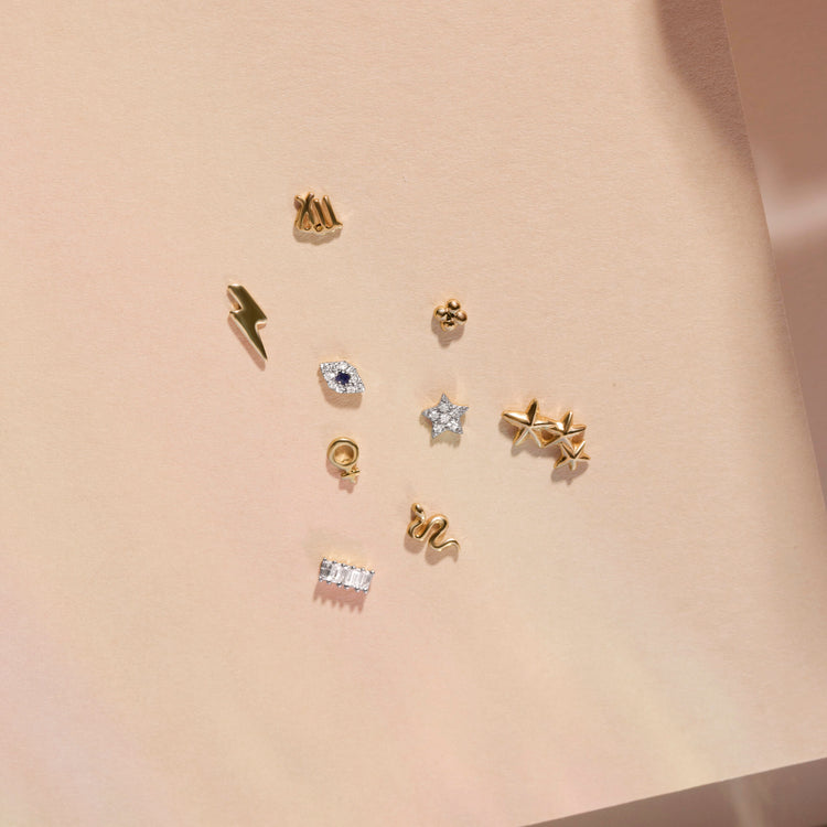 Still life image of Serpent Stud with Stone and Strand solid gold jewelry