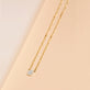 Stone and Strand 10K Yellow Gold Tiny Shield of Strength Diamond Necklace Editorial Image