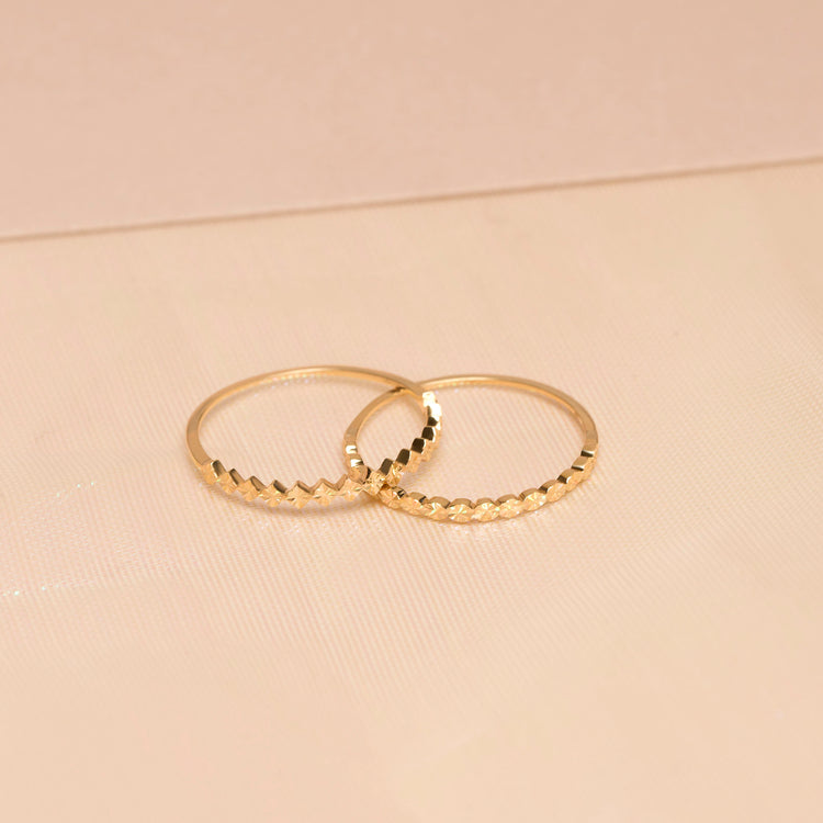 Still life image of Spark Circle Band with Stone and Strand solid gold jewelry