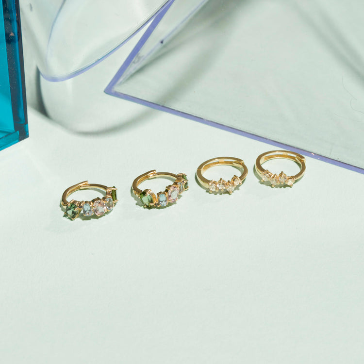 Still life image of Dainty Sparkle Diamond Cluster Huggies with Stone and Strand solid gold jewelry