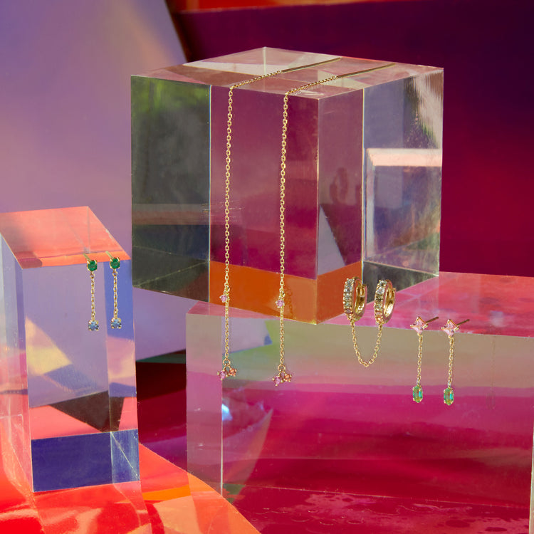 Still life image of Strawberry Sunset Threaders with Stone and Strand solid gold jewelry