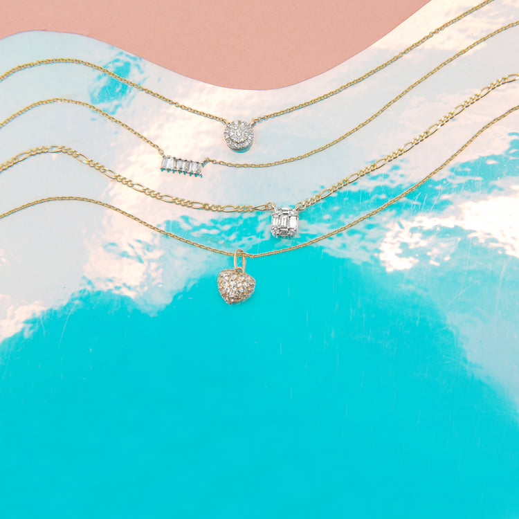 Still life image of Strength in Solitude Necklace with Stone and Strand solid gold jewelry