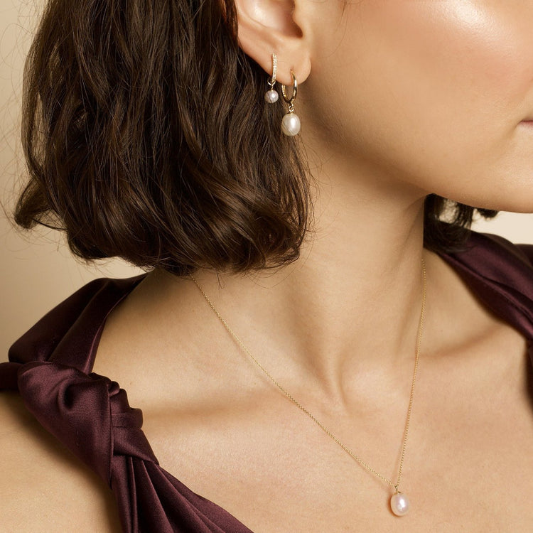 Model wearing Freshwater Droplet Pearl Pave Diamond Huggies with solid gold Stone and Strand jewelry