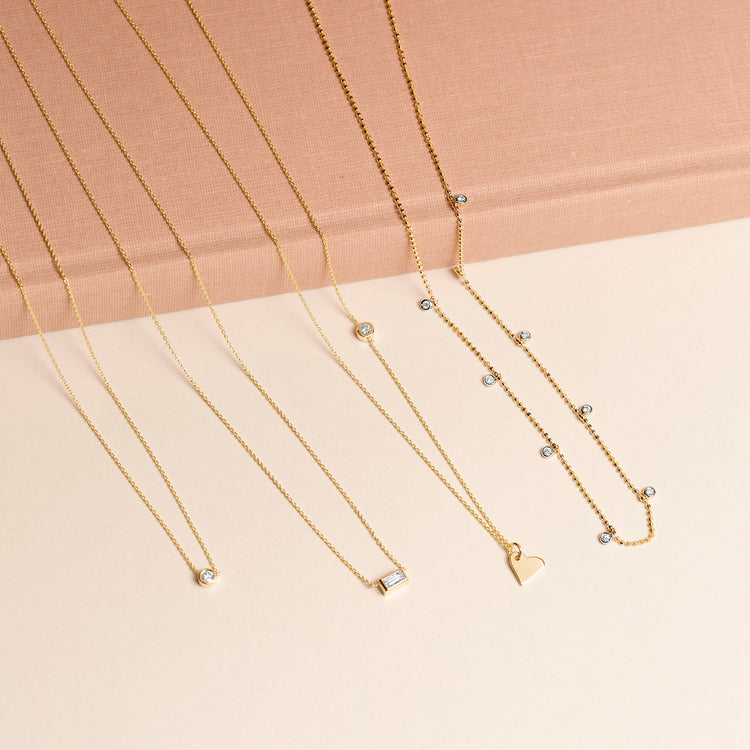 Still life image of Teeny Dangling Diamond Bead Chain Necklace with Stone and Strand solid gold jewelry