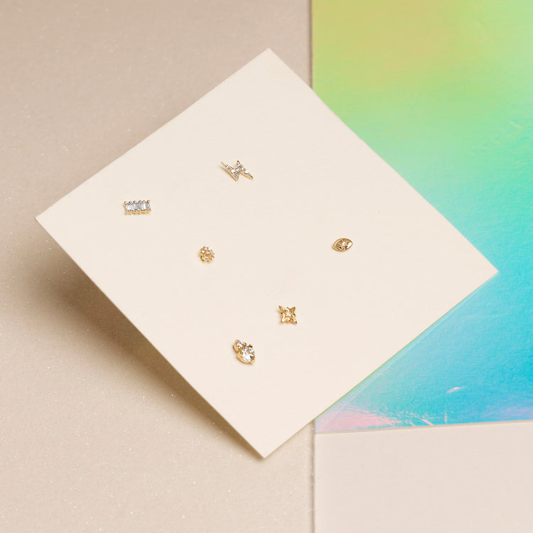Still life image of Tiny Diamond Flower Stud with Stone and Strand solid gold jewelry