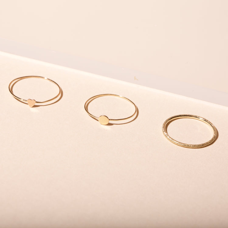 Still life image of Teeny Heart Ring with Stone and Strand solid gold jewelry